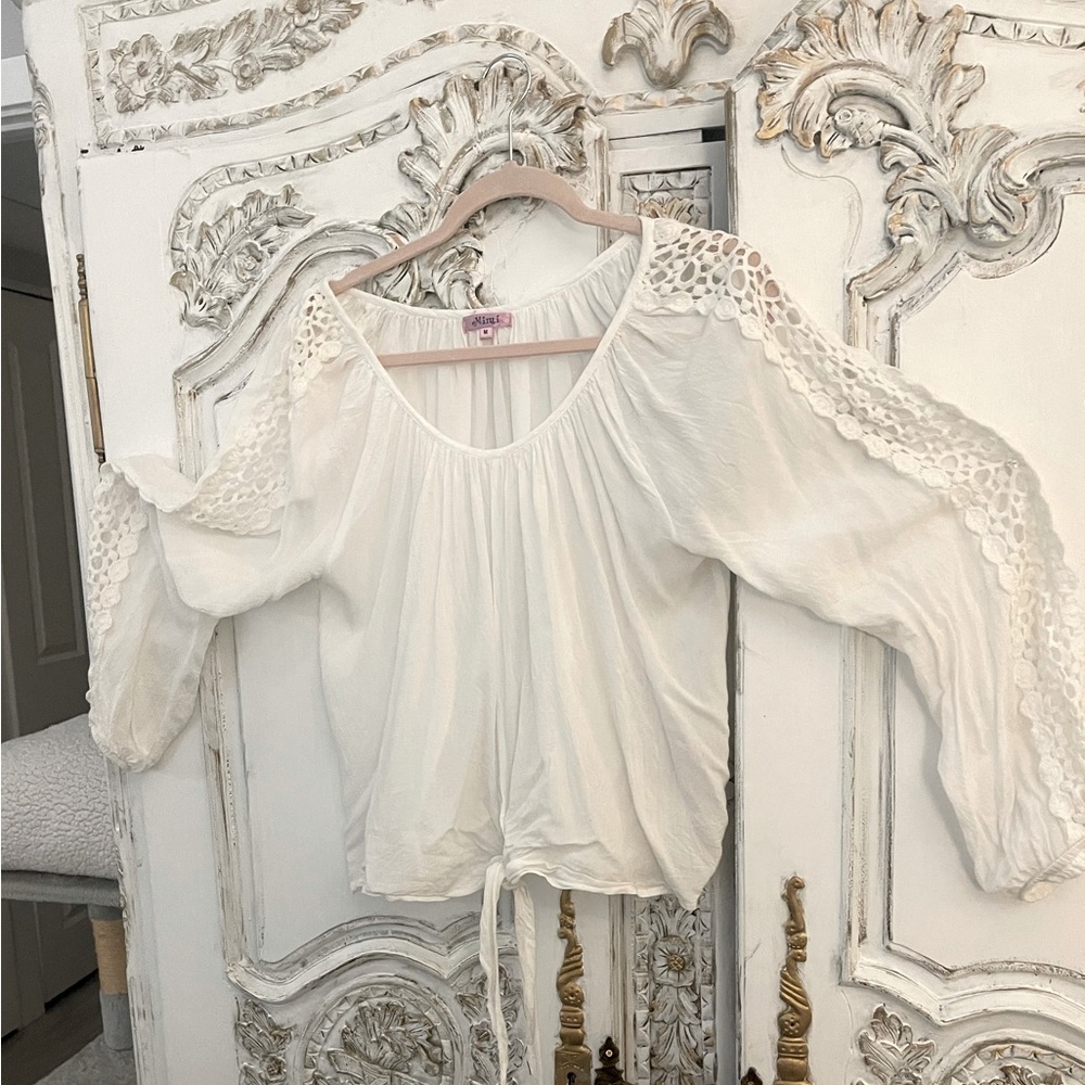 White cotton blouse with lace openings on sleeves